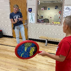 April Morse, Affective Needs Teacher at Academy Endeavour Elementary plays with students during gym class
